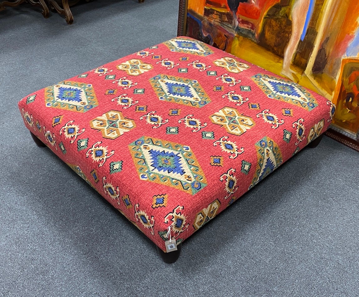 A large square contemporary footstool upholstered in red ground Kilim style fabric, width 102cm, height 27cm